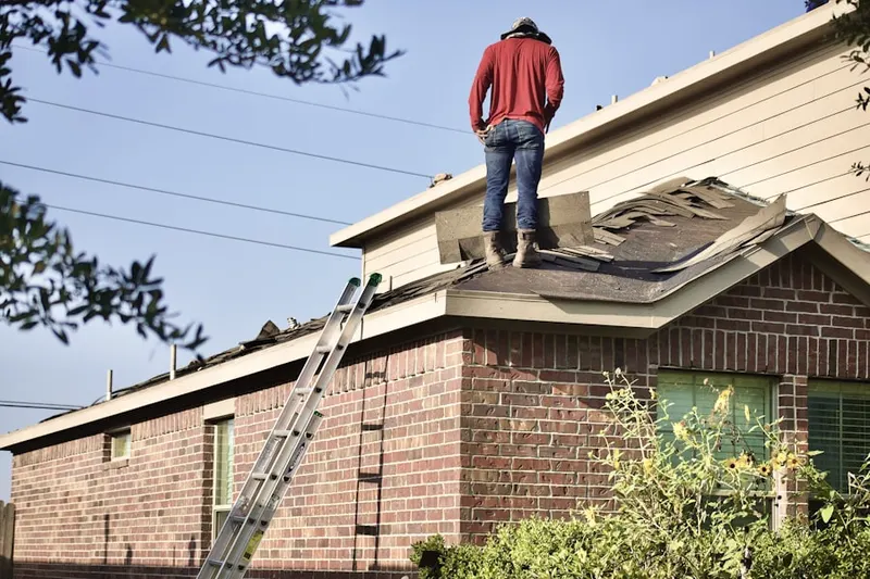 Professional roofer working on a residential roof in East Stanwood